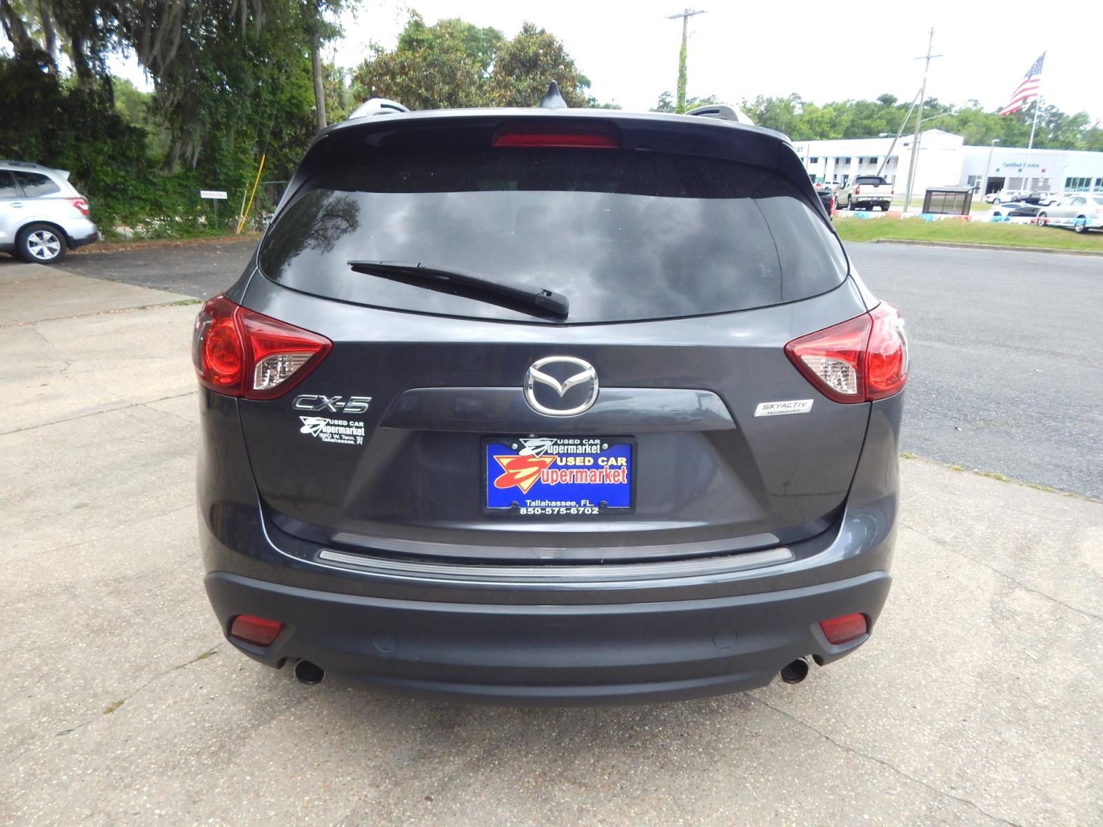 2014 Charcoal /Charcoal Mazda CX-5 Grand Touring (JM3KE2DY7E0) with an 2.5l-4 cyl. engine, Automatic transmission, located at 3120 W Tennessee St, Tallahassee, FL, 32304-1002, (850) 575-6702, 30.458841, -84.349648 - Used Car Supermarket is proud to present you with this loaded immaculate 2014 Mazda CX-5 Grand Touring with leather, sunroof and Navigation. Used Car Supermarket prides itself in offering you the finest pre-owned vehicle in Tallahassee. Used Car Supermarket has been locally family owned and operated - Photo #2